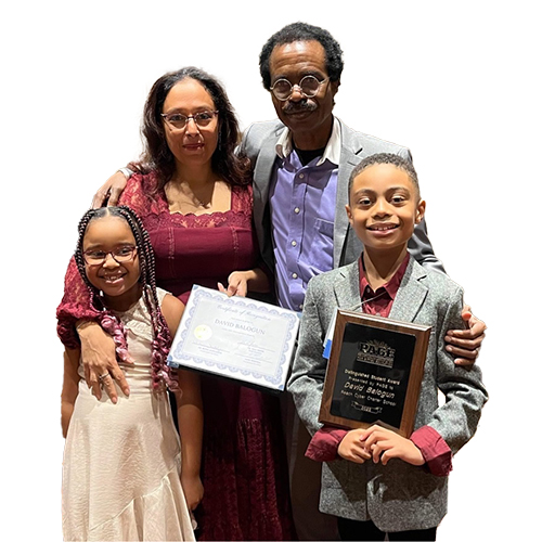 The Balogun family family poses for a family photo.