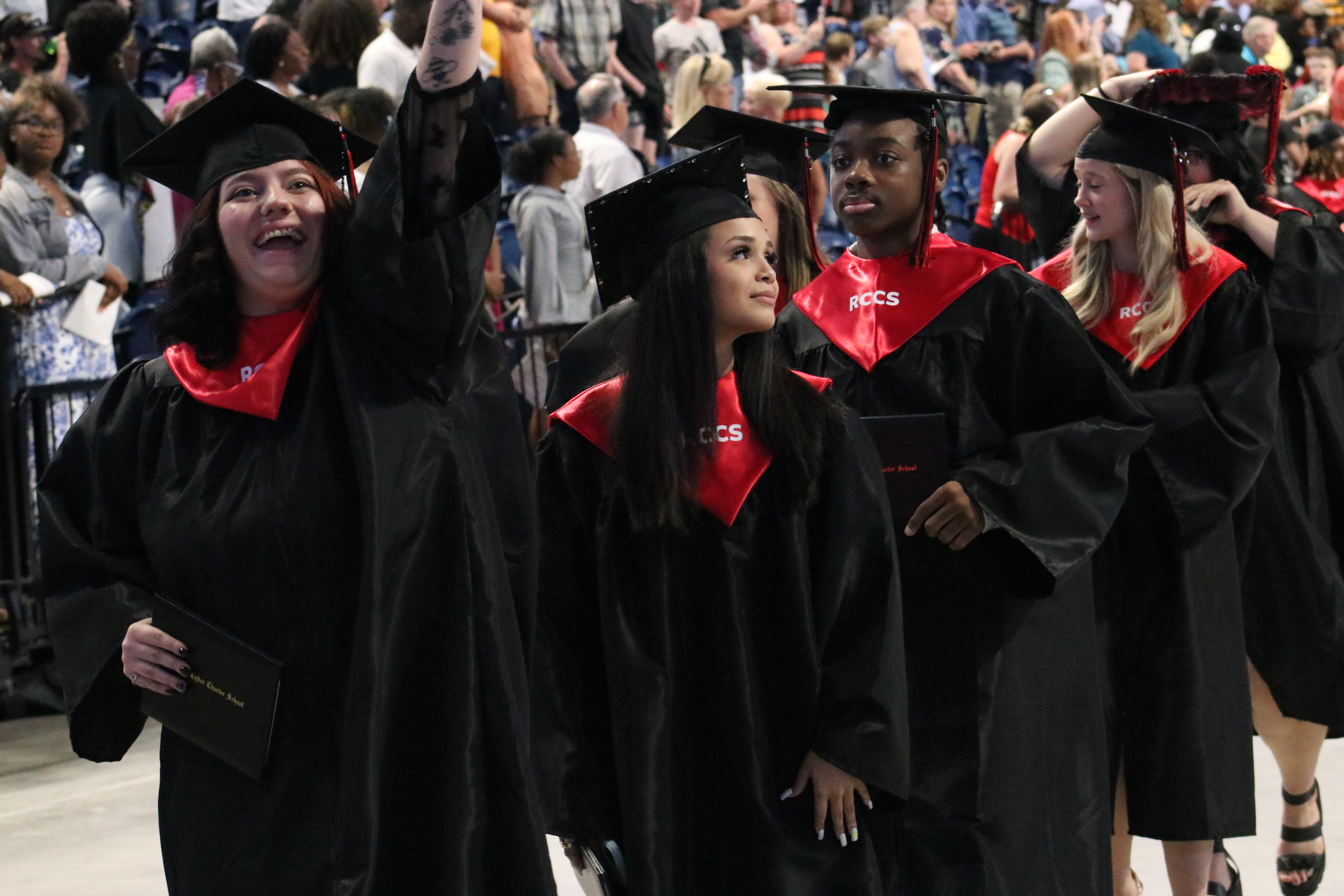 Graduating students receiving their diplomas at Reach Cyber Charter School's 2023-24 graduation