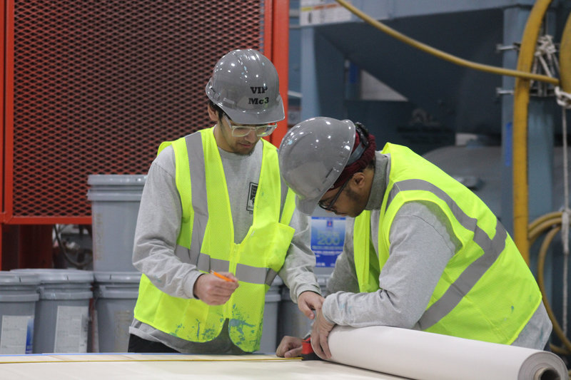 Here's a couple of our Reach Rockets hard at work, putting their lessons into practice during our Career Readiness partnership with the Finishing Trades Institute.