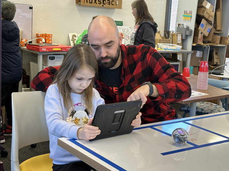 In Pittsburgh, this student was learning how to make the ball robot complete a maze using their lessons from STEM during Computer Science Week.