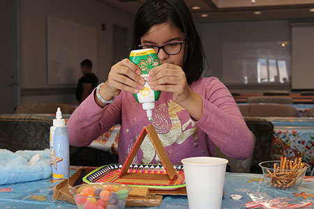 We are always learning even at our social events.  Students were able to learn about architecture and design at our Gingerbread House build at The Franklin Institute.