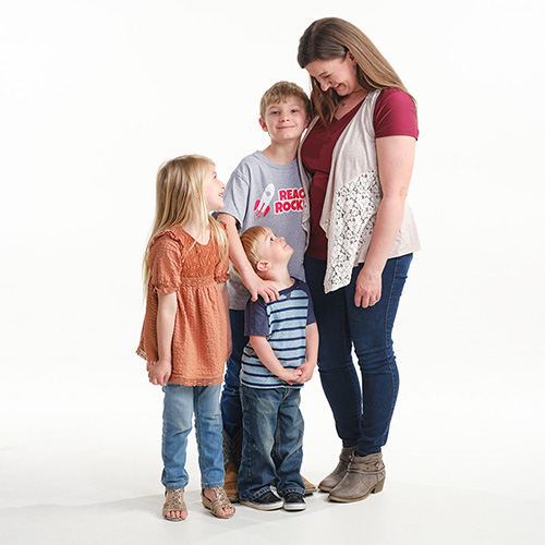 The Perry family poses for a family photo.